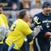 Former Michigan football players Duke Haynes and Mark Bolach joke around during the annual alumni flag football game before spring practice at Michigan Stadium on Saturday, April 13, 2013. Melanie Maxwell I AnnArbor.com